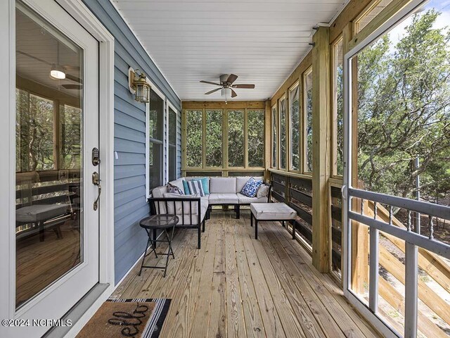 sunroom / solarium with ceiling fan