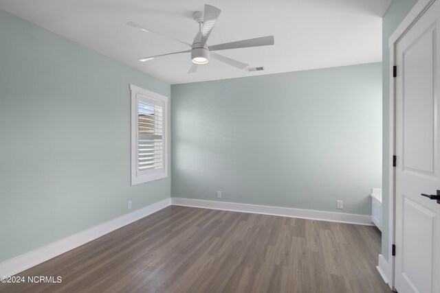 spare room featuring ceiling fan and light hardwood / wood-style flooring