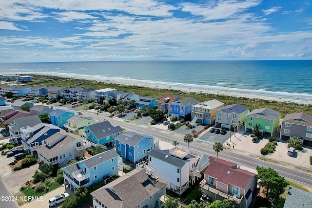 bird's eye view featuring a beach view and a water view