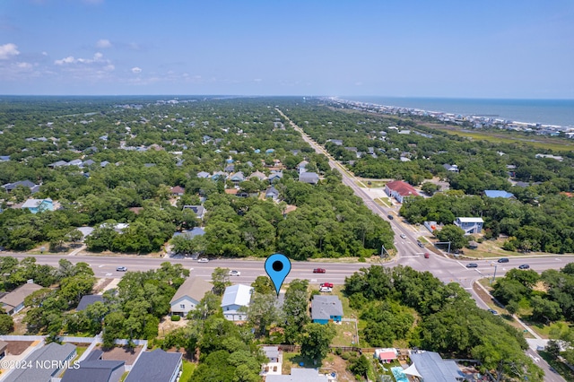 drone / aerial view with a water view and a residential view