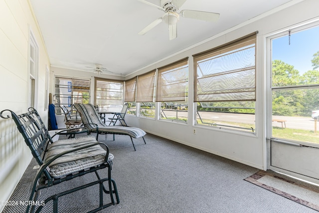 sunroom with a ceiling fan