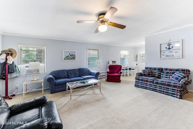 living area featuring a healthy amount of sunlight, carpet, and ornamental molding