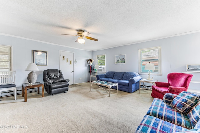 living area featuring carpet, a textured ceiling, ceiling fan, and crown molding