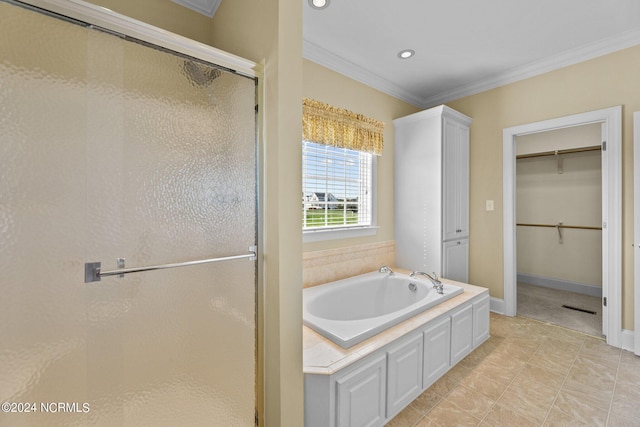 bathroom featuring crown molding, a spacious closet, a shower stall, baseboards, and a bath