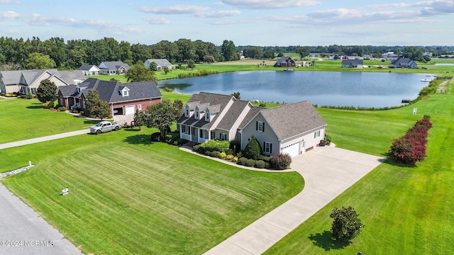 drone / aerial view with a residential view and a water view