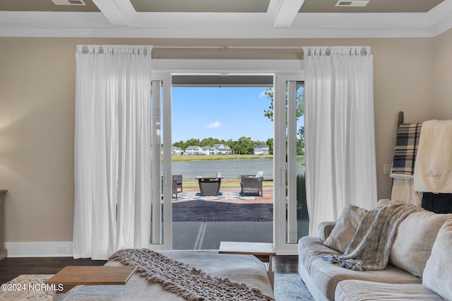 doorway to outside with hardwood / wood-style flooring, beamed ceiling, and a water view