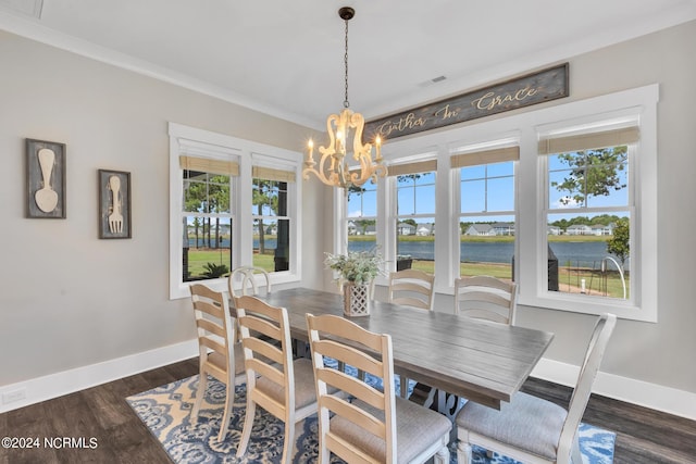 dining space featuring ornamental molding, a water view, dark hardwood / wood-style floors, and a notable chandelier