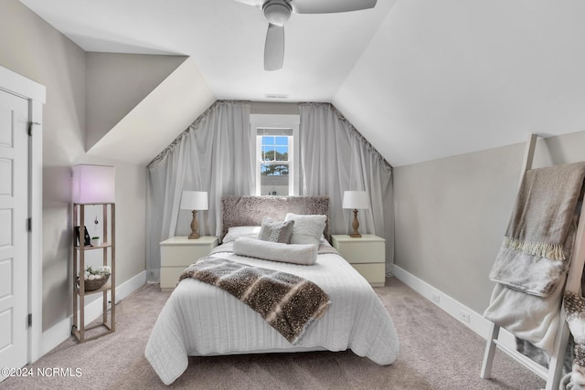 bedroom with lofted ceiling, light carpet, and ceiling fan