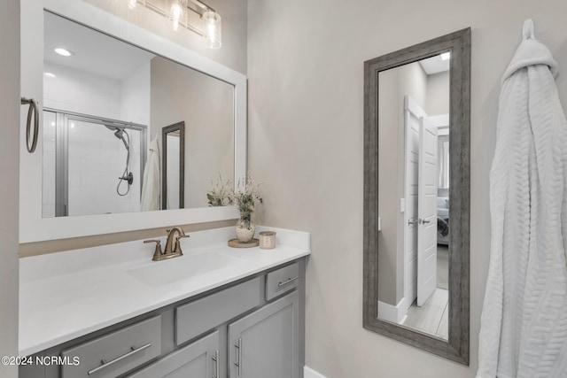 bathroom featuring vanity and an enclosed shower