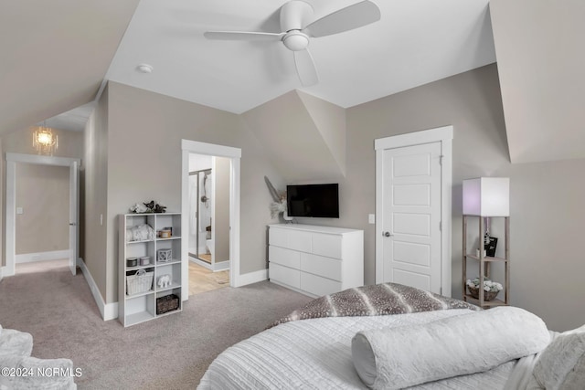 bedroom with lofted ceiling, light colored carpet, and ceiling fan