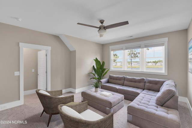 living room featuring ceiling fan and carpet floors