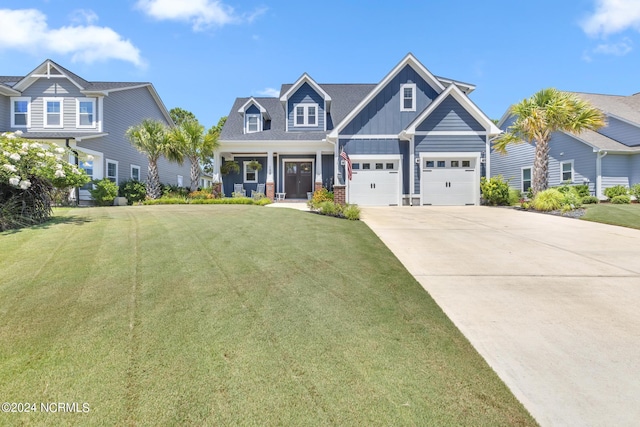 craftsman-style house with covered porch and a front yard