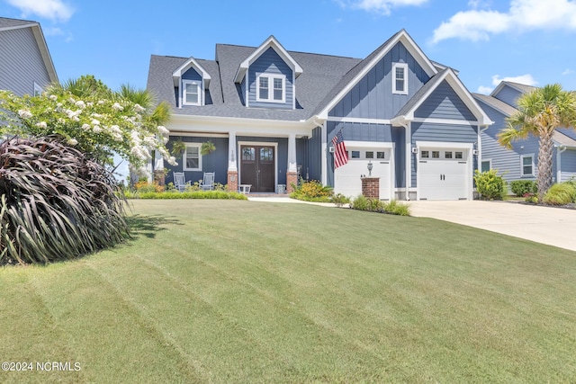 view of front of house with a front yard and a porch