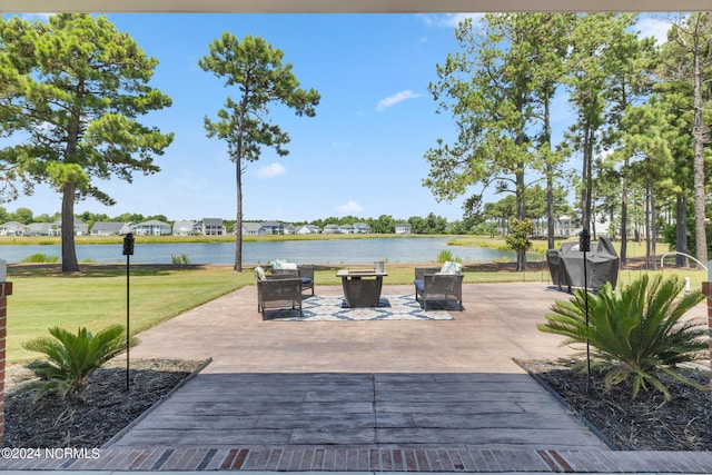 view of patio with a water view and grilling area