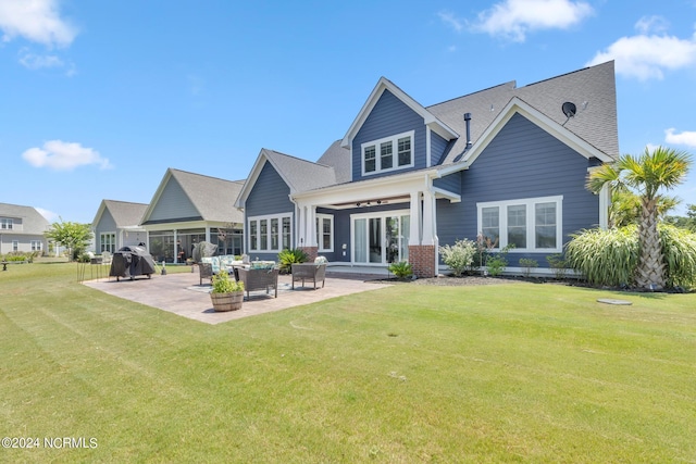 back of house with a yard, a patio area, and outdoor lounge area