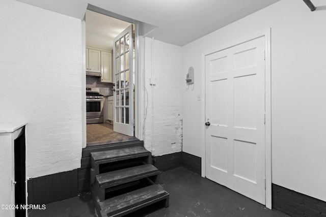 staircase with concrete floors