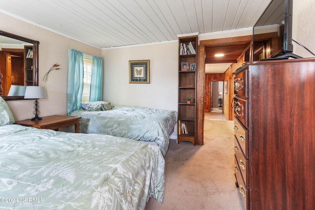 bedroom featuring crown molding, wood walls, light colored carpet, and wooden ceiling