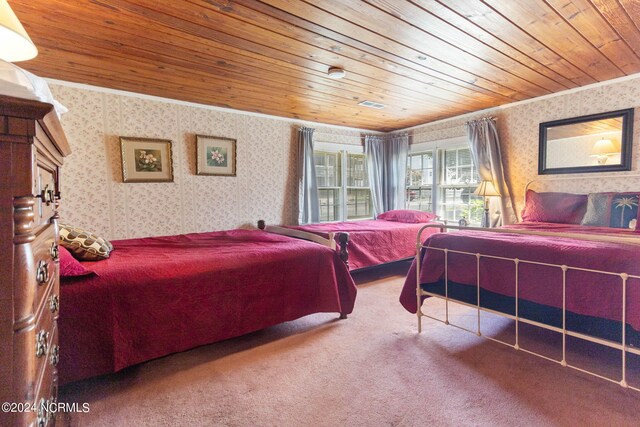 bedroom featuring ornamental molding, carpet flooring, and wooden ceiling