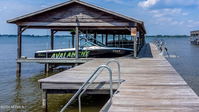 dock area featuring a water view and boat lift