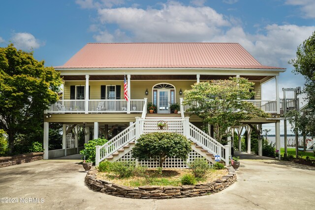 view of front of home featuring a porch and a carport