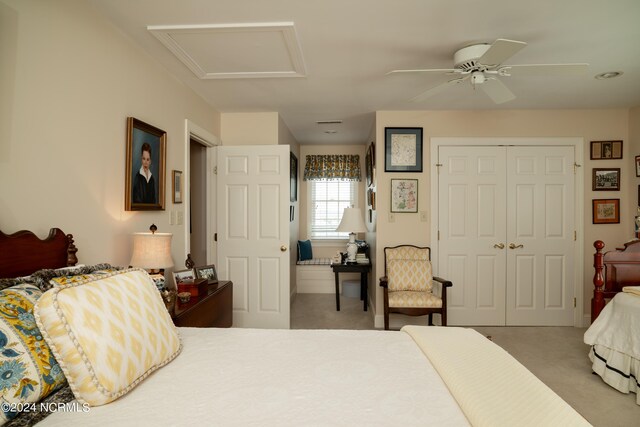 carpeted bedroom with a closet and ceiling fan