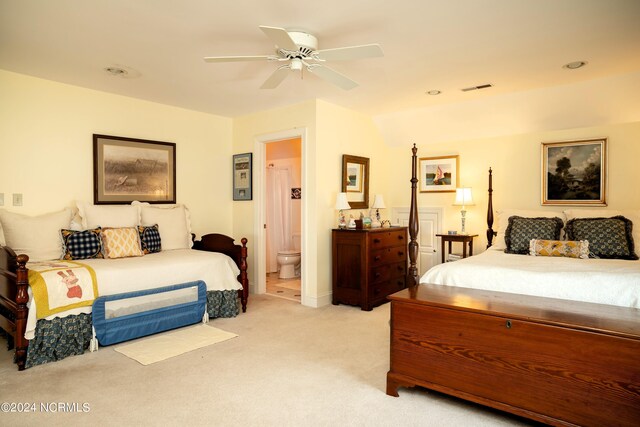 carpeted bedroom featuring connected bathroom and ceiling fan