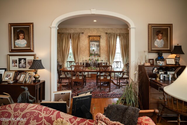 living room featuring hardwood / wood-style flooring and ornamental molding