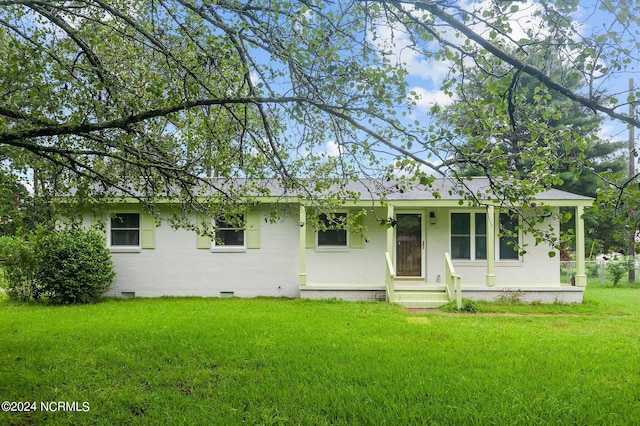 ranch-style house with covered porch, brick siding, crawl space, and a front lawn