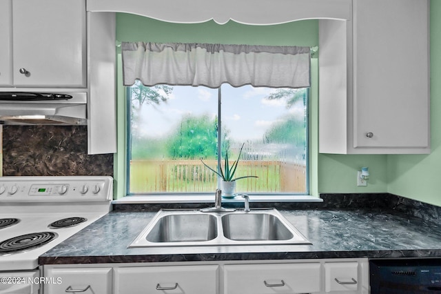 kitchen featuring electric stove, dark countertops, white cabinets, and under cabinet range hood