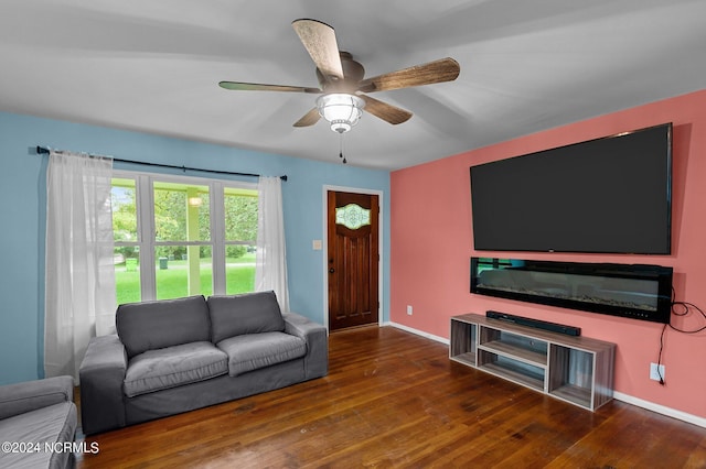 living room featuring hardwood / wood-style flooring and ceiling fan