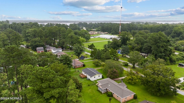 aerial view featuring a wooded view