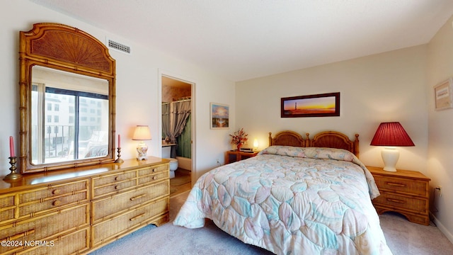 carpeted bedroom featuring a walk in closet and a closet