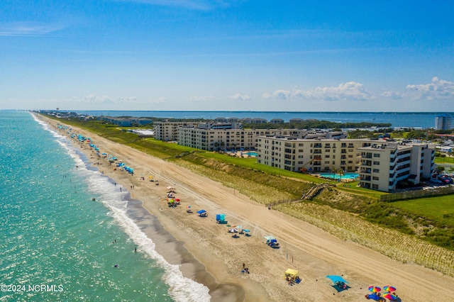 drone / aerial view with a water view and a view of the beach