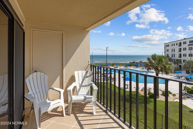 balcony featuring a water view