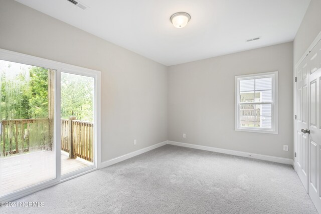 unfurnished room featuring carpet floors