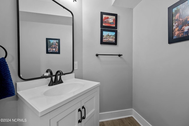 bathroom featuring hardwood / wood-style floors and vanity