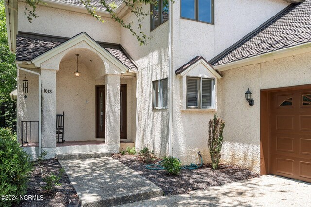 entrance to property featuring a garage