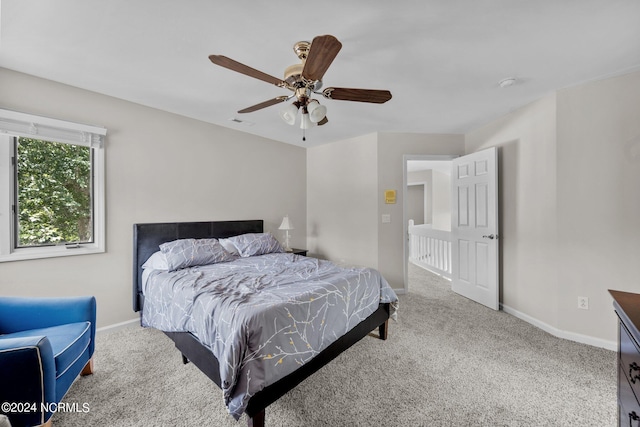 bedroom with ceiling fan and carpet floors