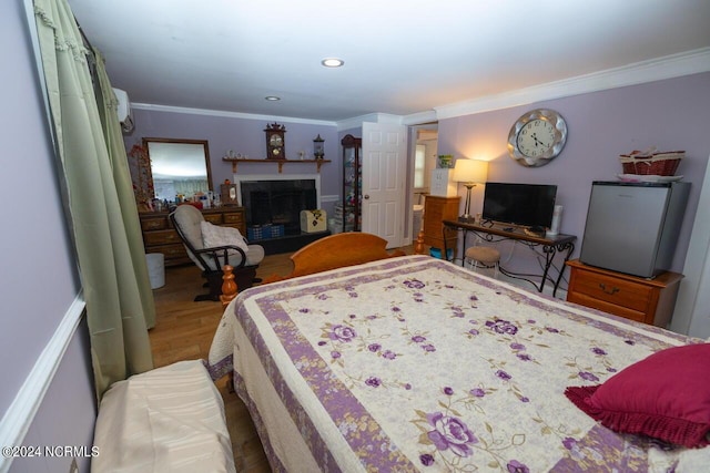 bedroom with ornamental molding and wood-type flooring