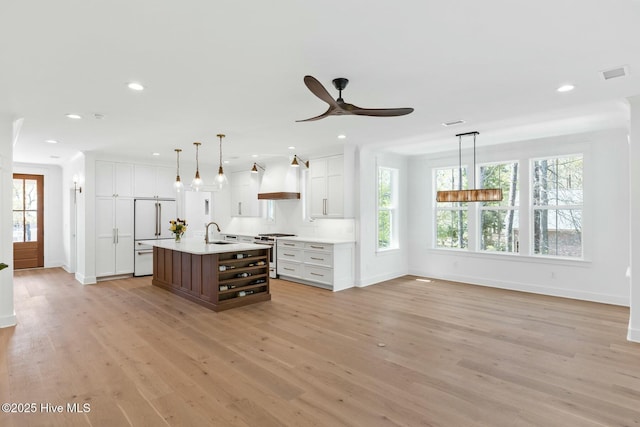3404 Eagle Crest Dr SW, Supply, NC 28462 - kitchen featuring premium appliances, open shelves, light countertops, baseboards, and plenty of natural light