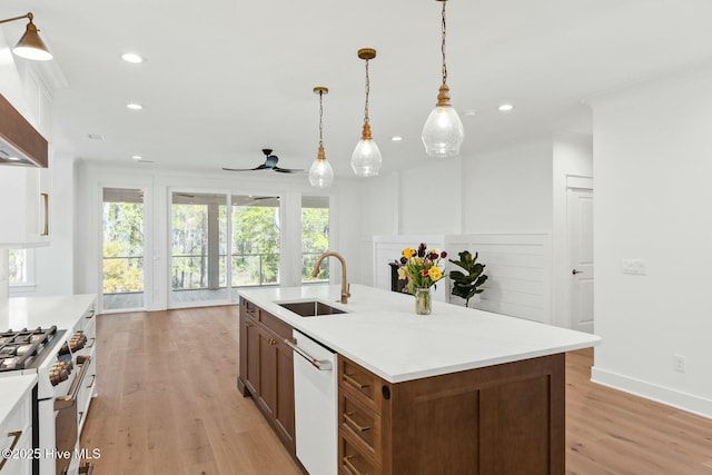 3404 Eagle Crest Dr SW, Supply, NC 28462 - kitchen with a sink, white appliances, recessed lighting, light wood-style floors, and light countertops