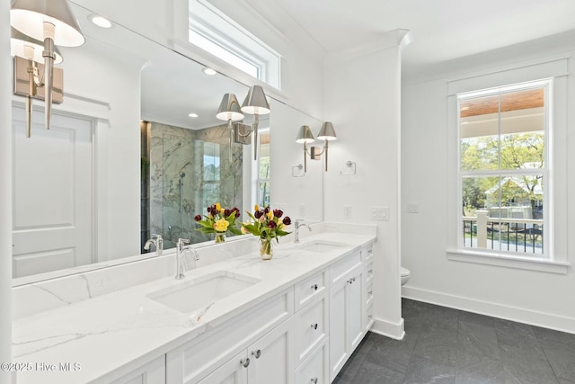 3404 Eagle Crest Dr SW, Supply, NC 28462 - bathroom featuring baseboards, a marble finish shower, double vanity, toilet, and marble finish flooring