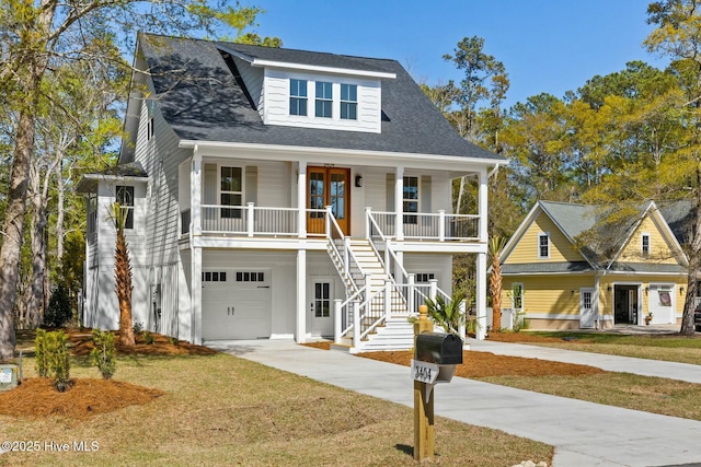 3404 Eagle Crest Dr SW, Supply, NC 28462 - view of front facade with covered porch, concrete driveway, an attached garage, a front lawn, and stairs
