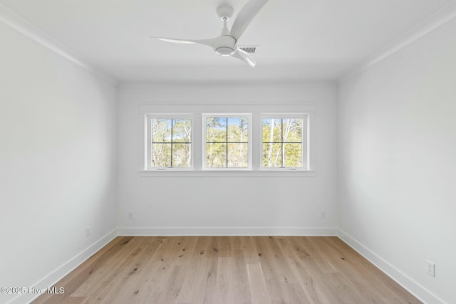 3404 Eagle Crest Dr SW, Supply, NC 28462 - spare room featuring light wood-style floors, baseboards, a ceiling fan, and ornamental molding