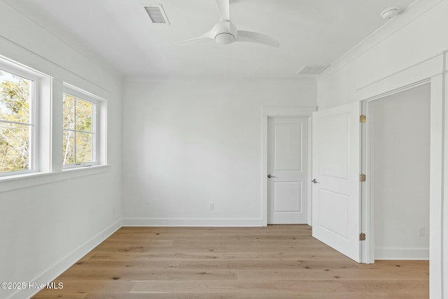 3404 Eagle Crest Dr SW, Supply, NC 28462 - unfurnished room featuring ceiling fan, light wood-type flooring, baseboards, a smoke detector, and crown molding