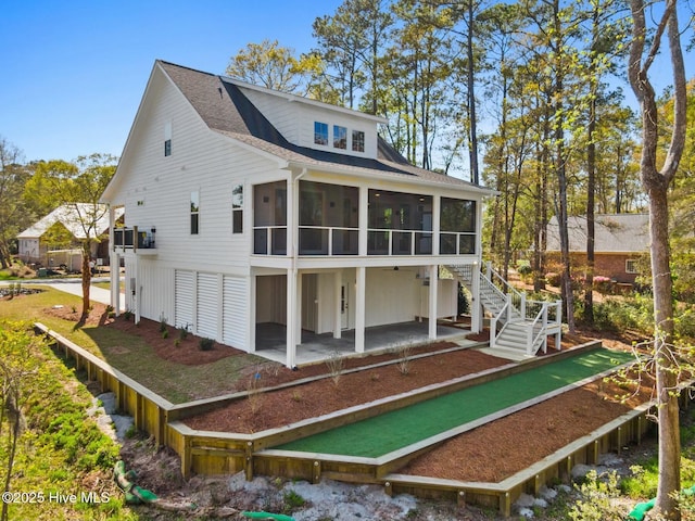 3404 Eagle Crest Dr SW, Supply, NC 28462 - rear view of house with a sunroom, a patio, and a shingled roof