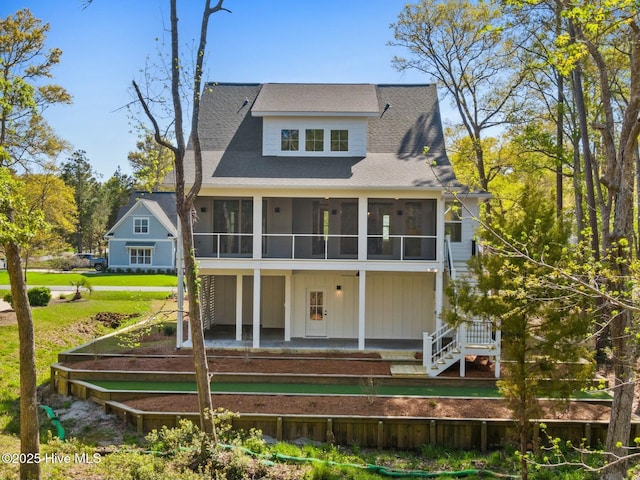 3404 Eagle Crest Dr SW, Supply, NC 28462 - back of house with a sunroom, stairway, roof with shingles, and a yard