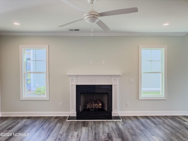 interior details featuring ceiling fan, wood-type flooring, and crown molding