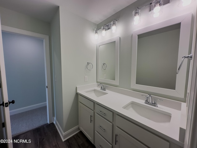 bathroom with hardwood / wood-style floors and vanity