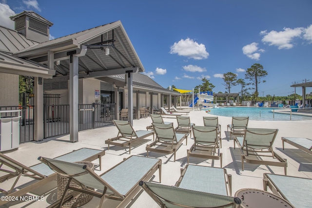 view of patio / terrace featuring a community pool